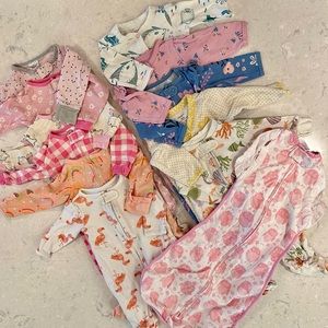 11 baby girls 0-3mo footed pajamas; and a 3-6mo (14-19lbs) Woombie sleep sack